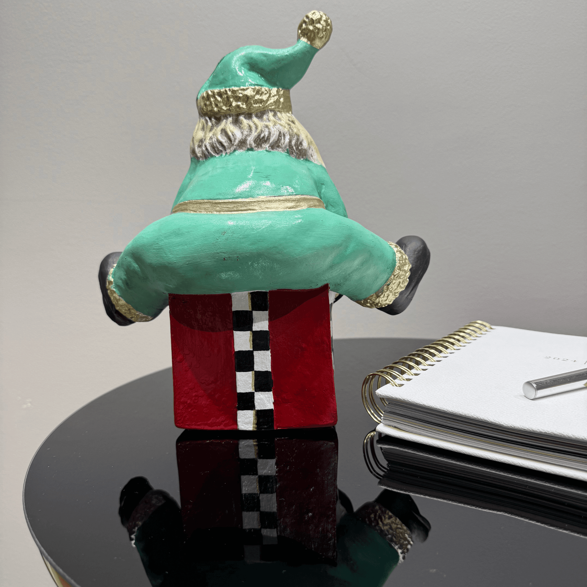 Ferozzi Playful Green Santa on Gift Box Figurine – Handcrafted Whimsical Holiday Decor