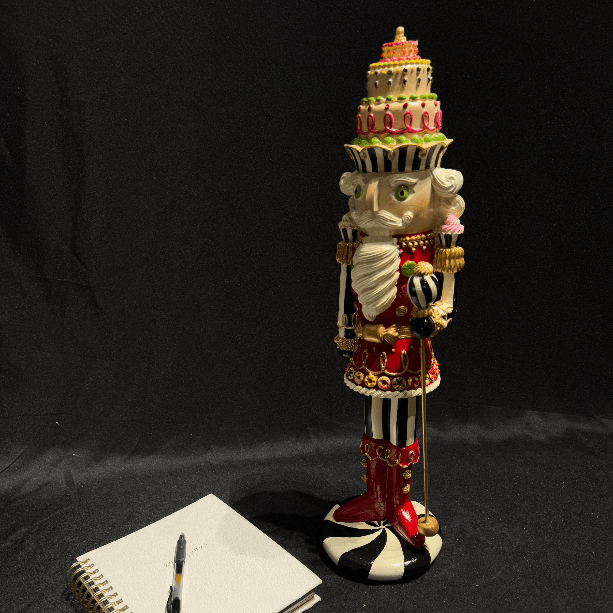 Nutcracker Statue with Layered Cake Design 