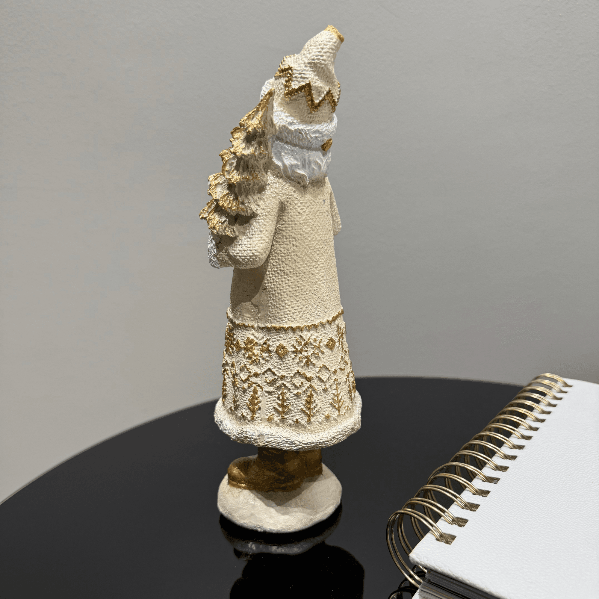 Cream Handmade Nutcracker Figurine with Gold Accents Holding a Squirrel