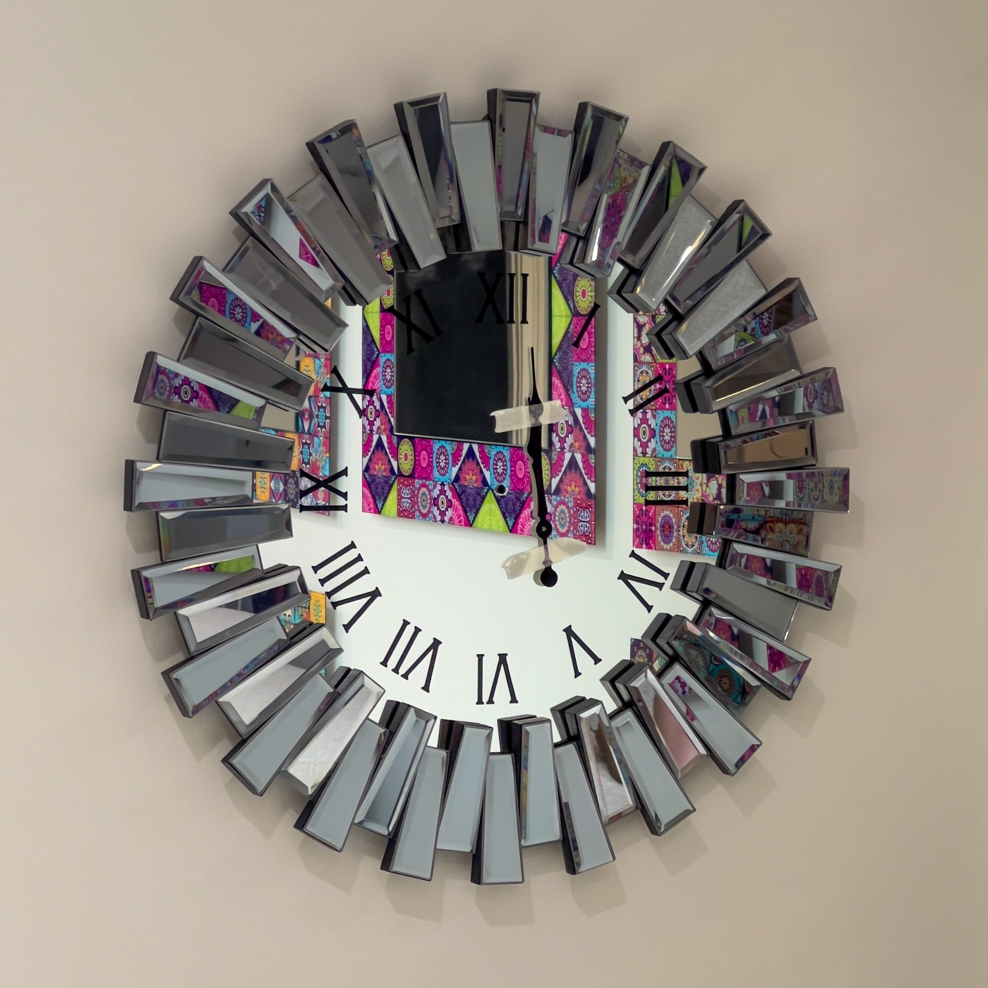 Small Ferozzi Modern Black Mirrored Wall Clock – Elegant and Eye-Catching Wall Decor