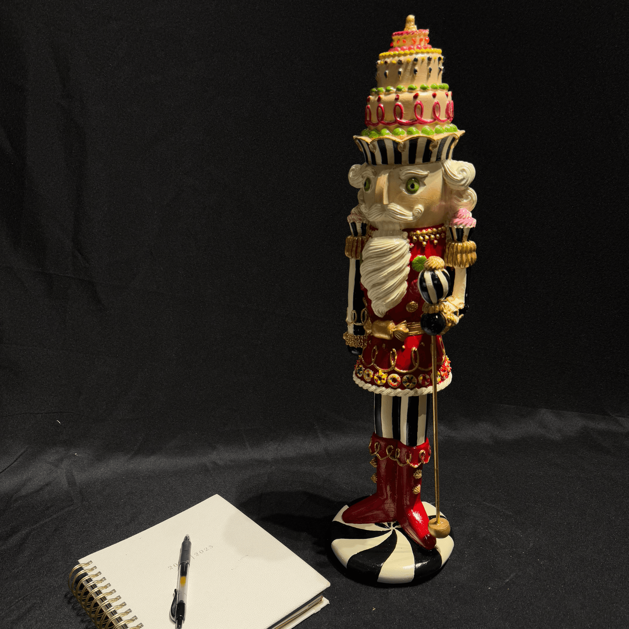 Nutcracker Statue with Layered Cake Design 