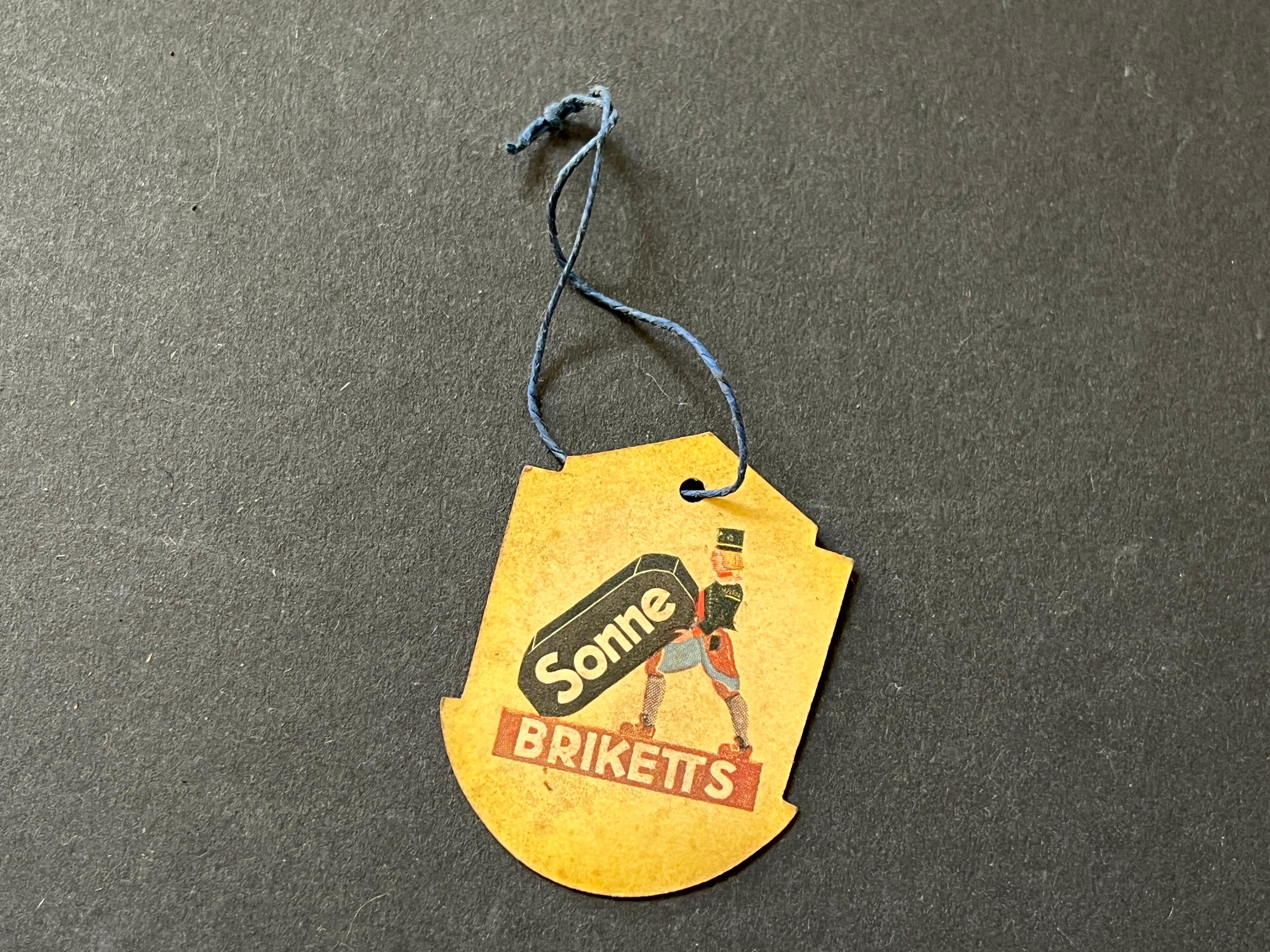 Papieranhänger "Sonne-Brickets" zur Messe