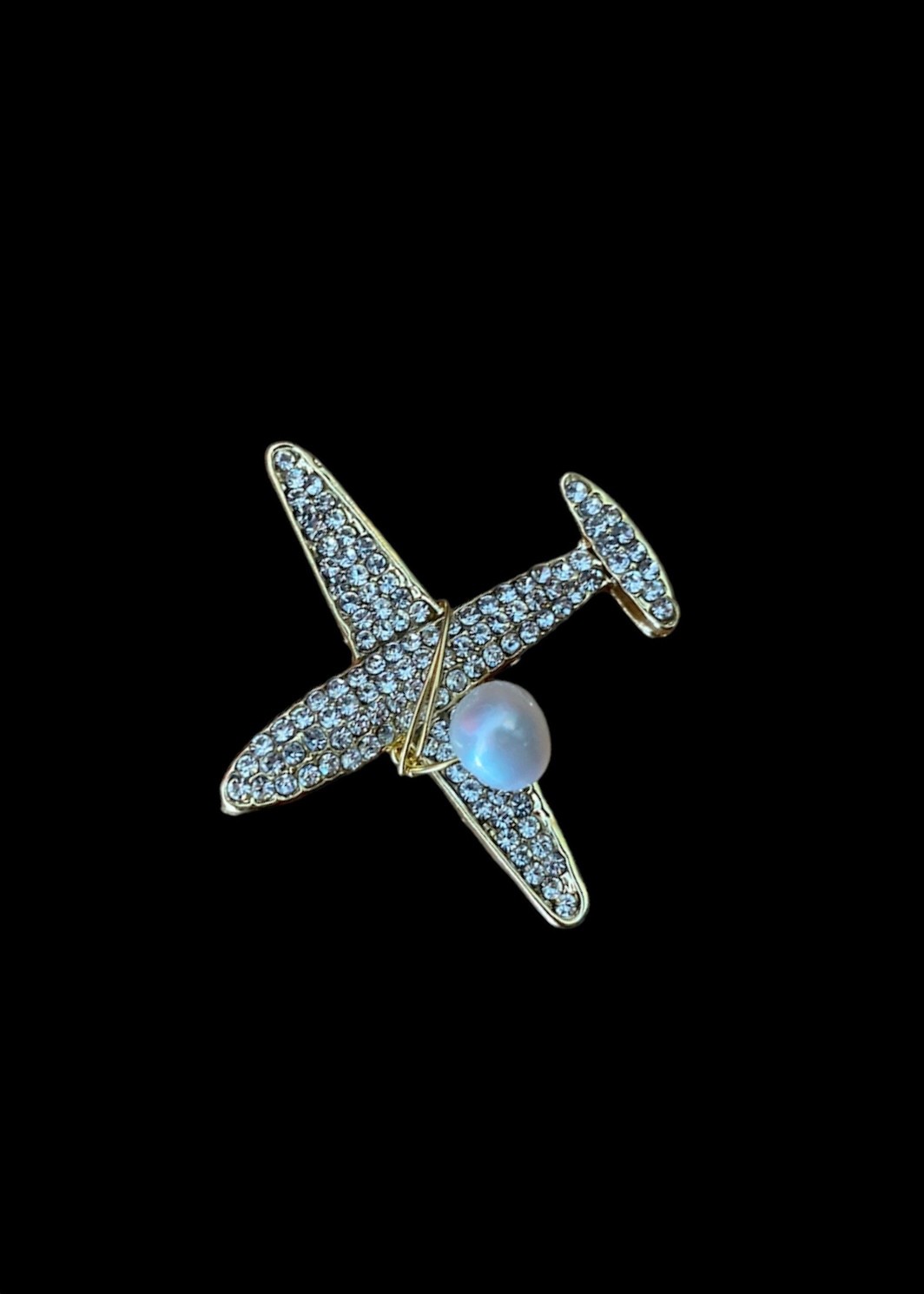 Airplane brooch with rhinestones and a real pearl 